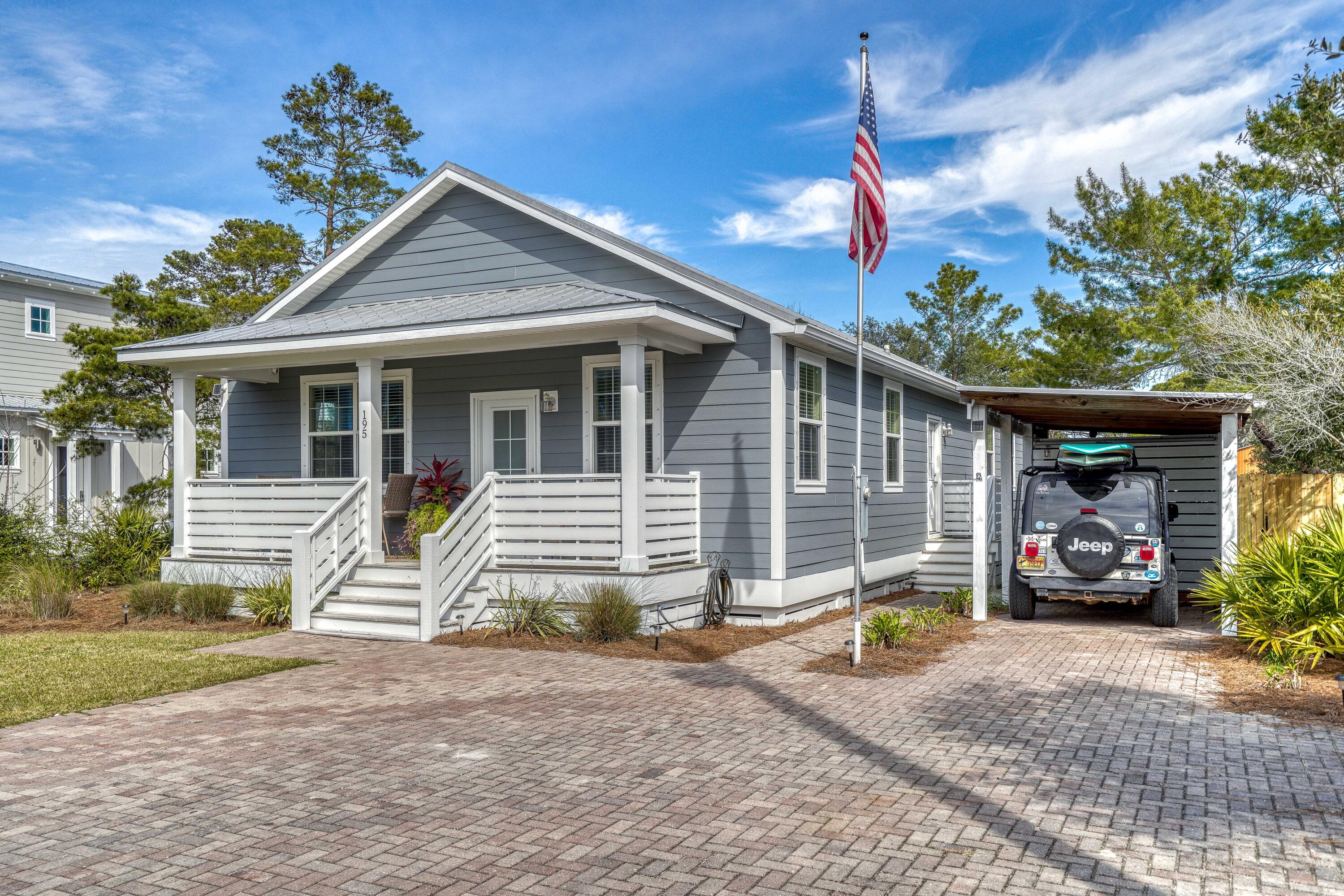 195 Maple Street Santa Rosa Beach, FL 32459 - Photo 1 of 29 a front view of a house with a yard