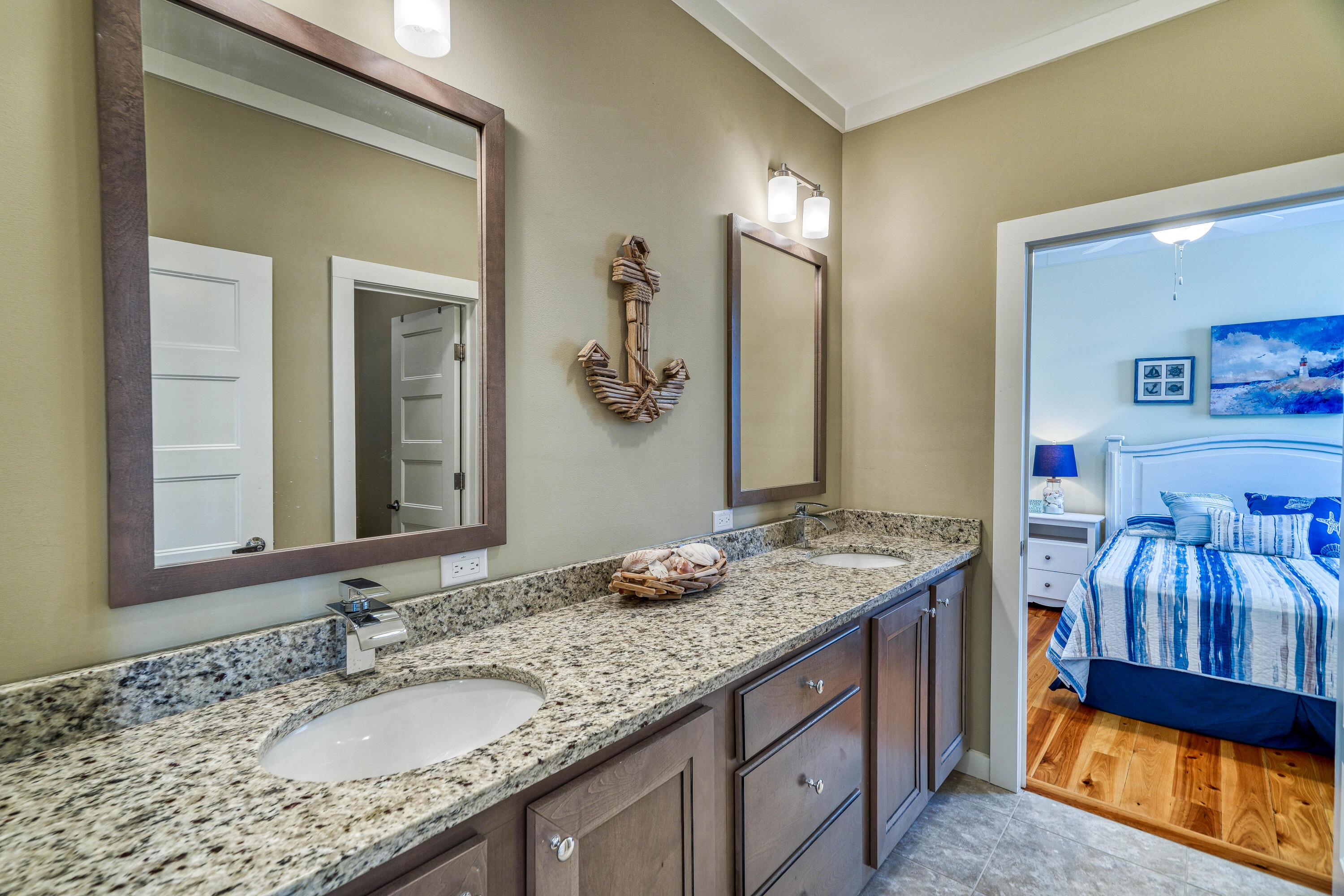 195 Maple Street Santa Rosa Beach, FL 32459 - Photo 15 of 29 a bathroom with a granite countertop sink and a mirror