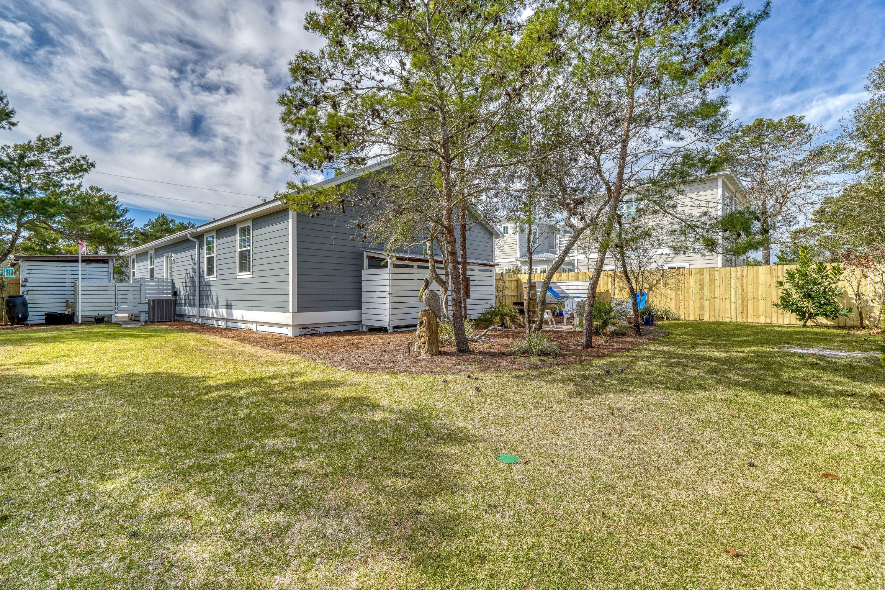 195 Maple Street Santa Rosa Beach, FL 32459 - Photo 24 of 29 a house with swimming pool in front of it
