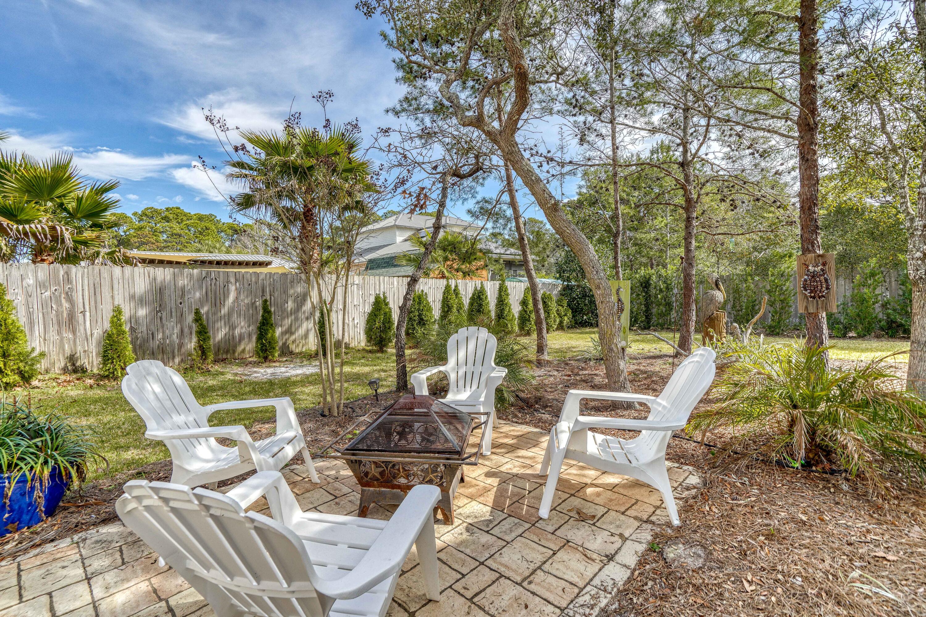 195 Maple Street Santa Rosa Beach, FL 32459 - Photo 25 of 29 a view of backyard with outdoor seating and plants