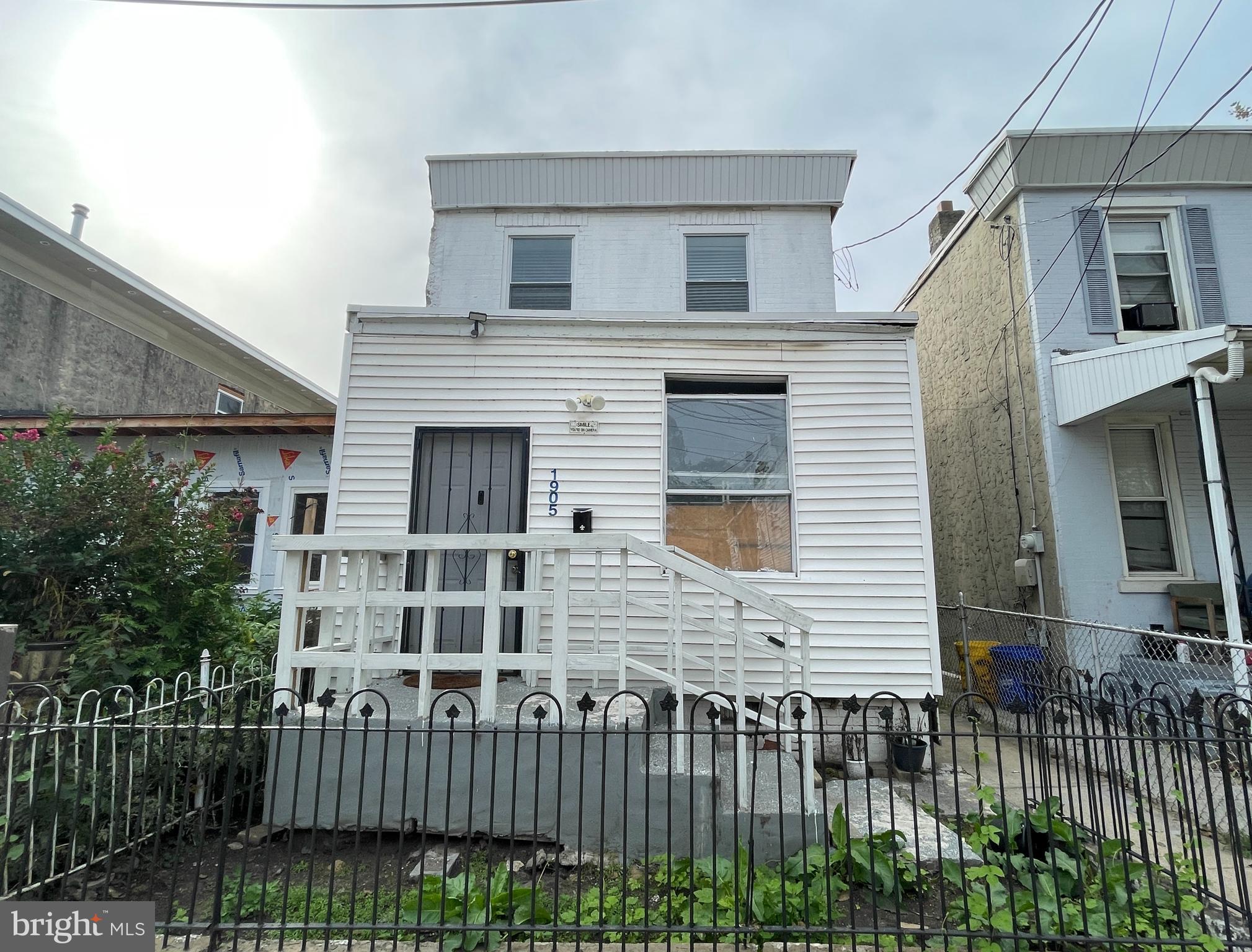 1905 Filmore Street Camden, NJ 08104 - Photo 1 of 10 a front view of a house with a garden