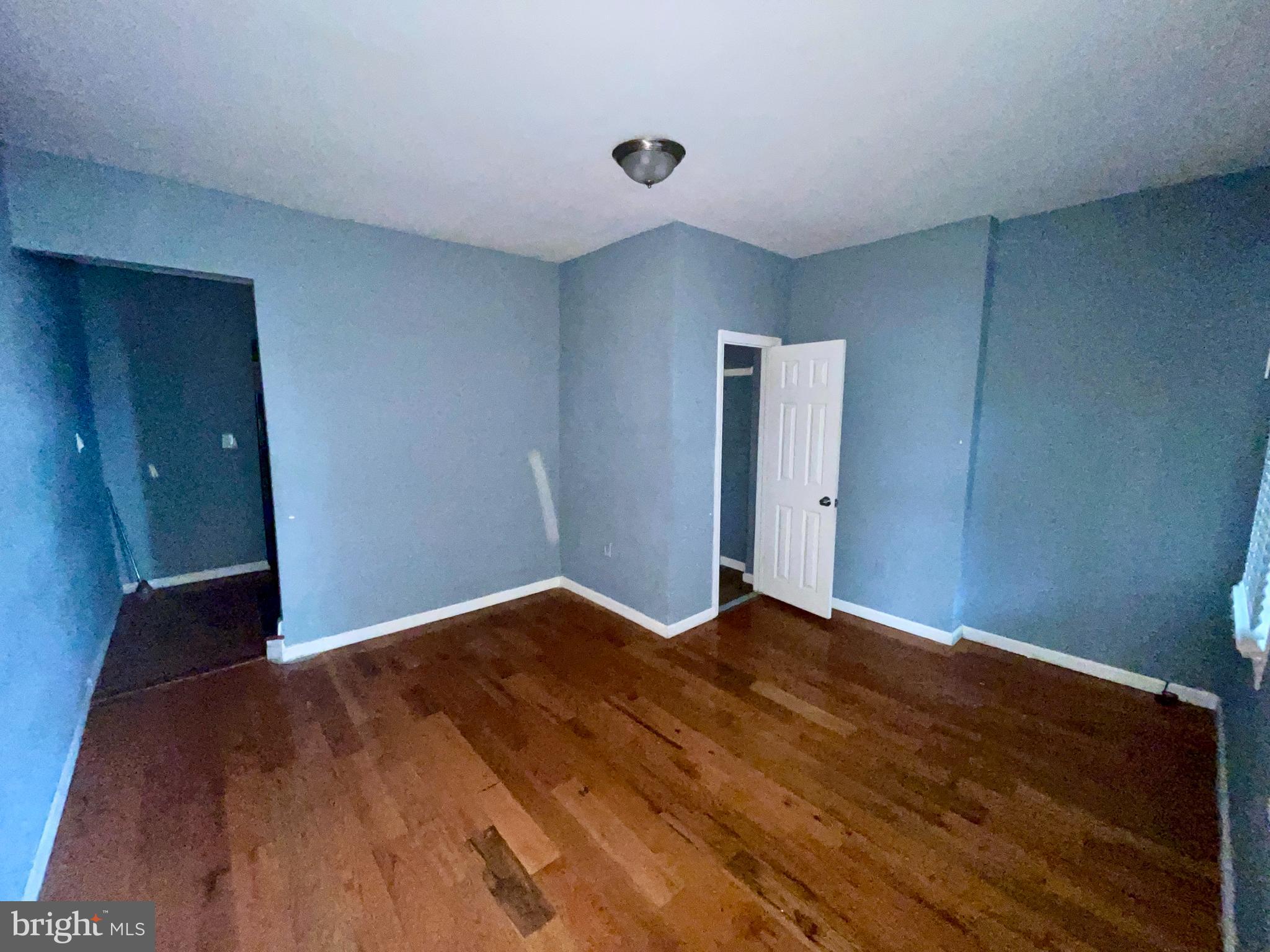 1905 Filmore Street Camden, NJ 08104 - Photo 3 of 10 a view of an empty room with wooden floor