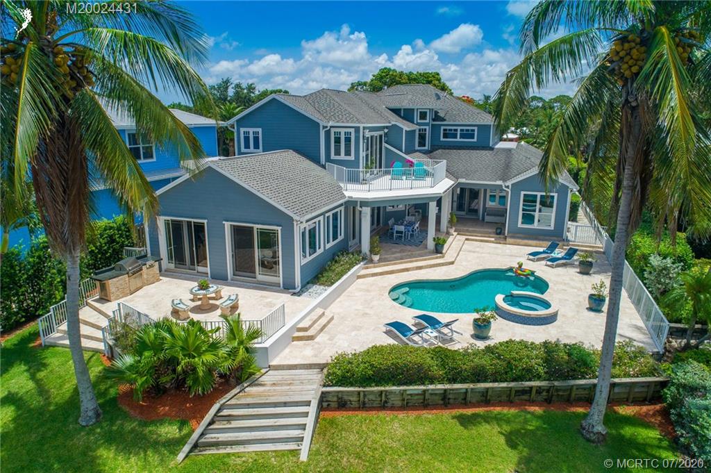 2021 Southeast Riverside Drive Stuart, FL 34996 - Photo 2 of 47 a front view of a house with garden