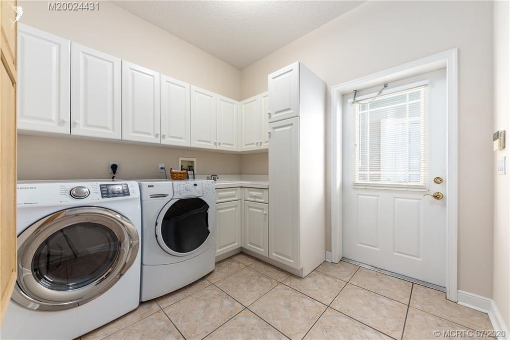 2021 Southeast Riverside Drive Stuart, FL 34996 - Photo 35 of 47 a utility room with dryer and washer