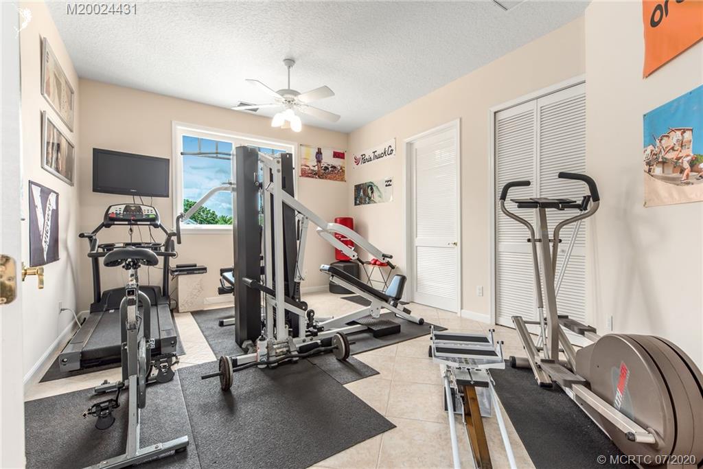 2021 Southeast Riverside Drive Stuart, FL 34996 - Photo 36 of 47 a view of a room with gym equipment