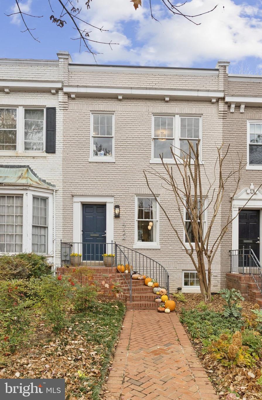 1724 34th Street Northwest Washington, DC 20007 - Photo 1 of 1 a front view of a house with a yard
