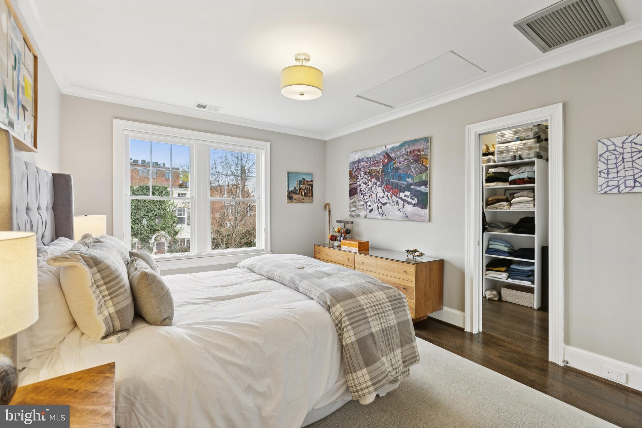 1724 34th Street Northwest Washington, DC 20007 - Photo 13 of 38 a bedroom with a bed and a window