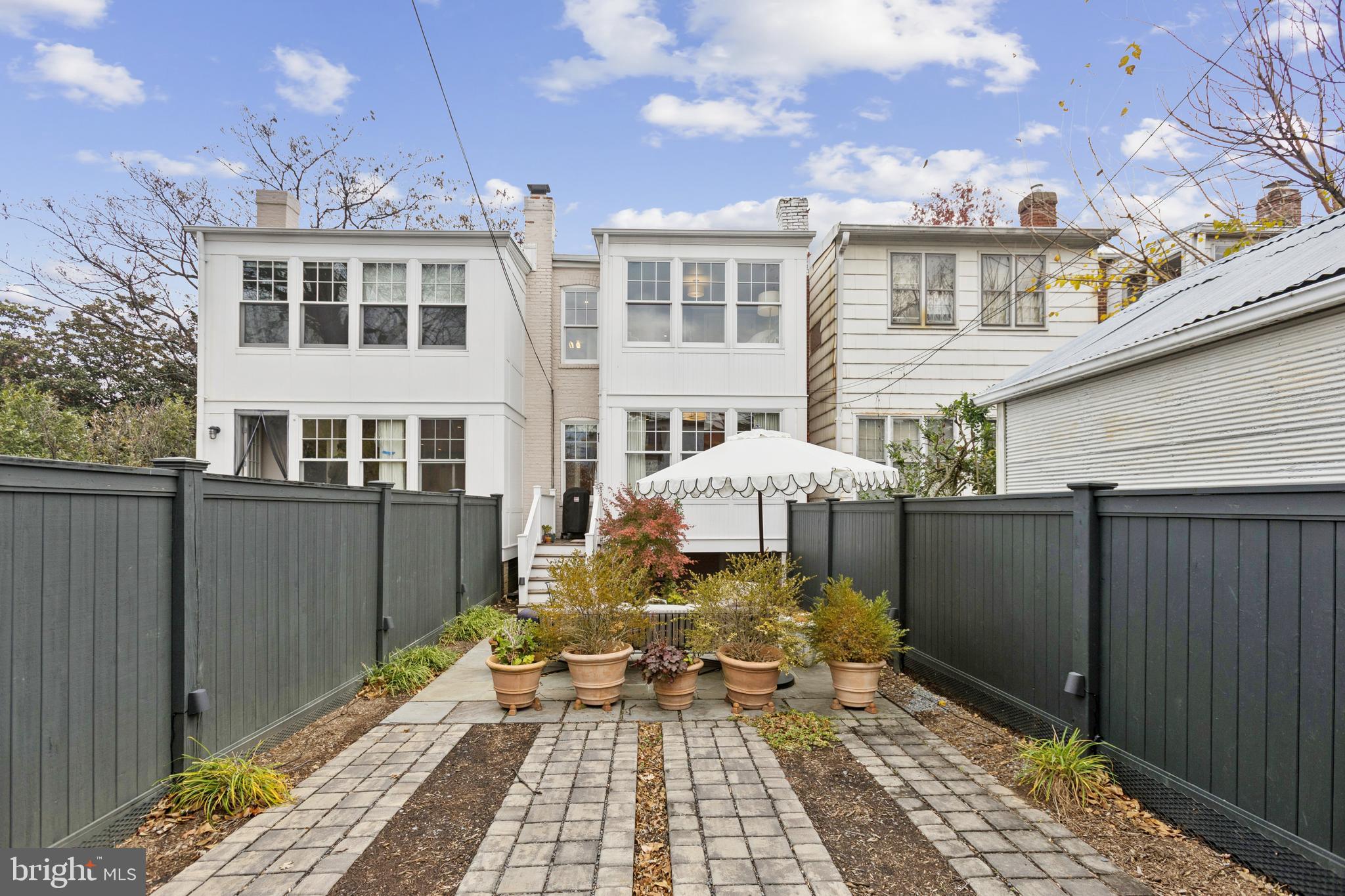 1724 34th Street Northwest Washington, DC 20007 - Photo 30 of 38 a front view of a house with a yard