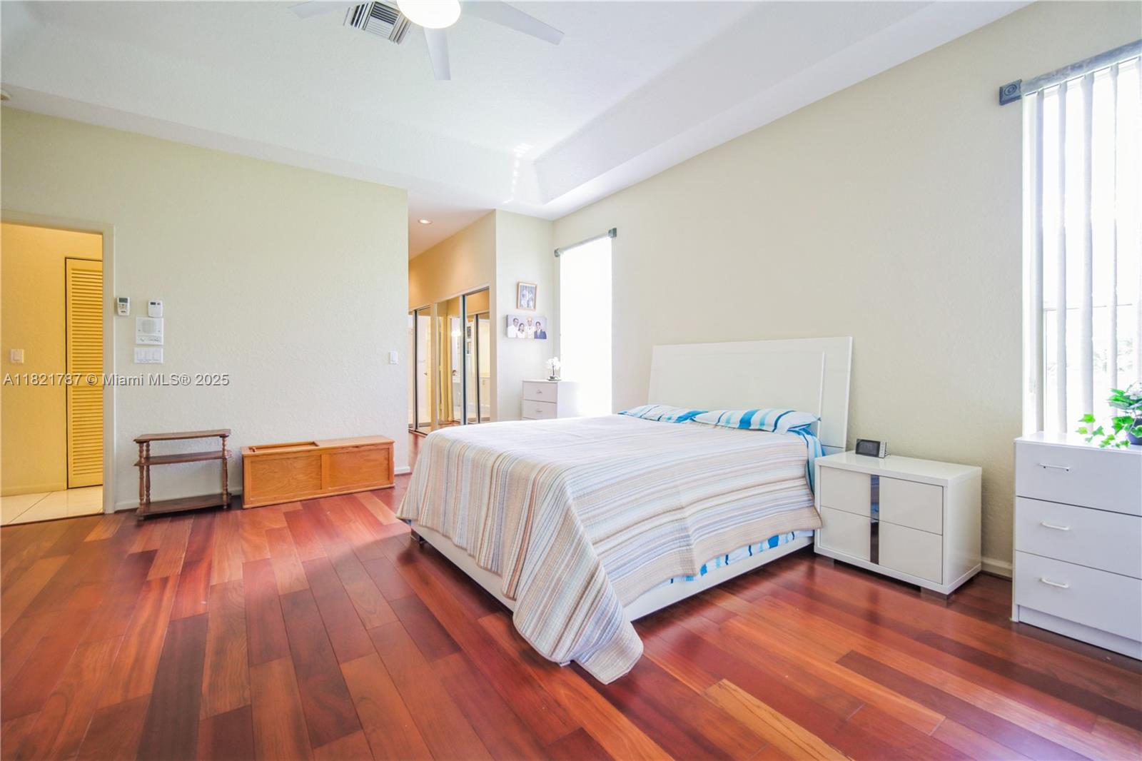 12620 Countryside Terrace Cooper City, FL 33330 - Photo 11 of 40 a spacious bedroom with a bed and a table in it