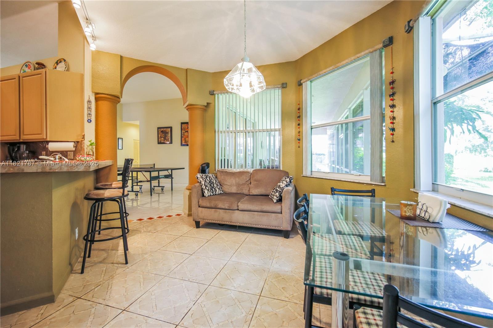 12620 Countryside Terrace Cooper City, FL 33330 - Photo 19 of 40 a living room with furniture and a large window