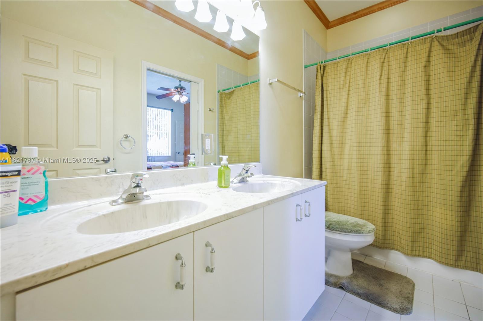 12620 Countryside Terrace Cooper City, FL 33330 - Photo 25 of 40 a bathroom with a sink a toilet and a mirror