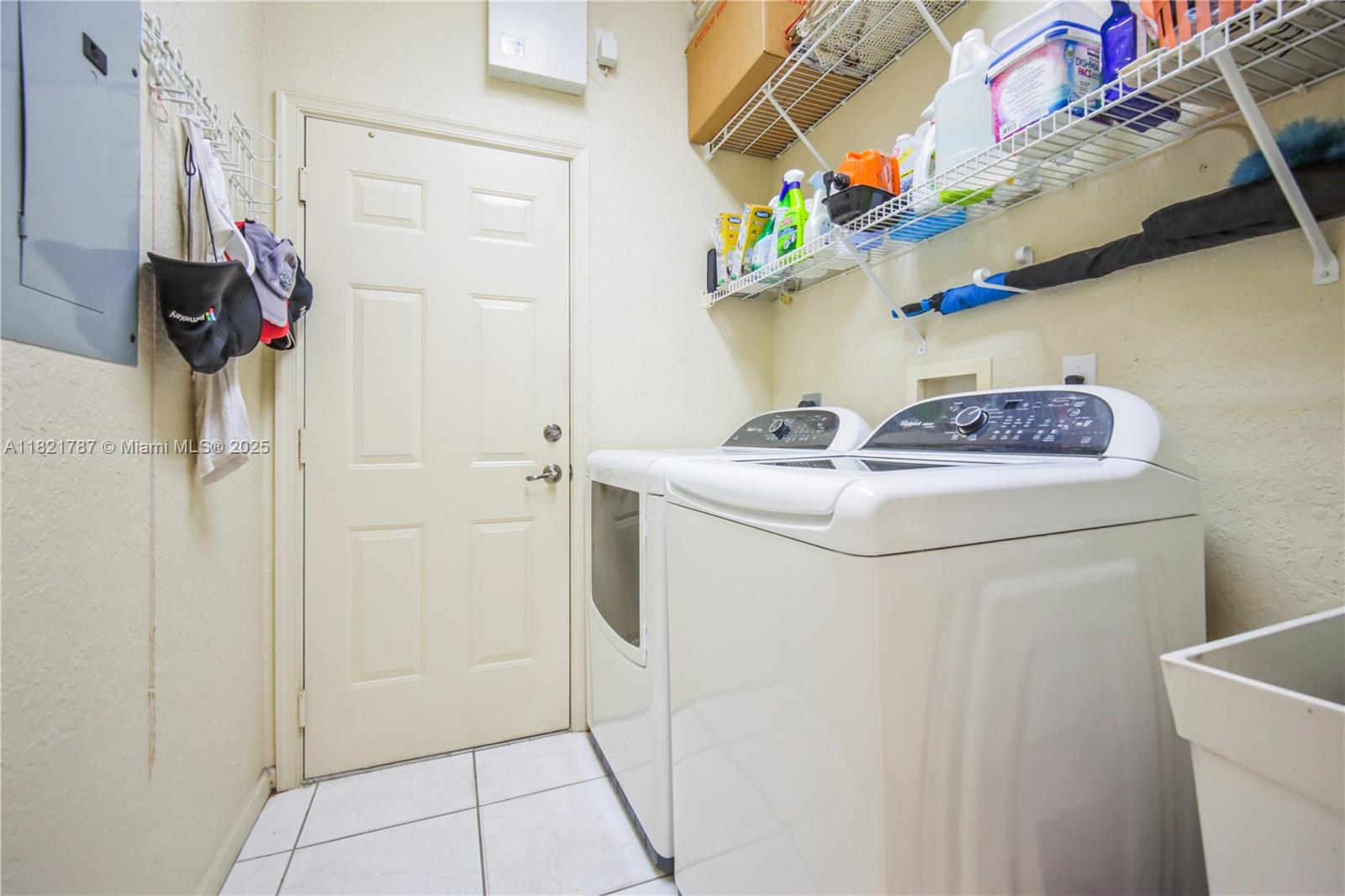 12620 Countryside Terrace Cooper City, FL 33330 - Photo 29 of 40 a utility room with dryer and washer