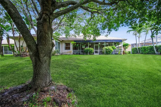 a big house with tall trees