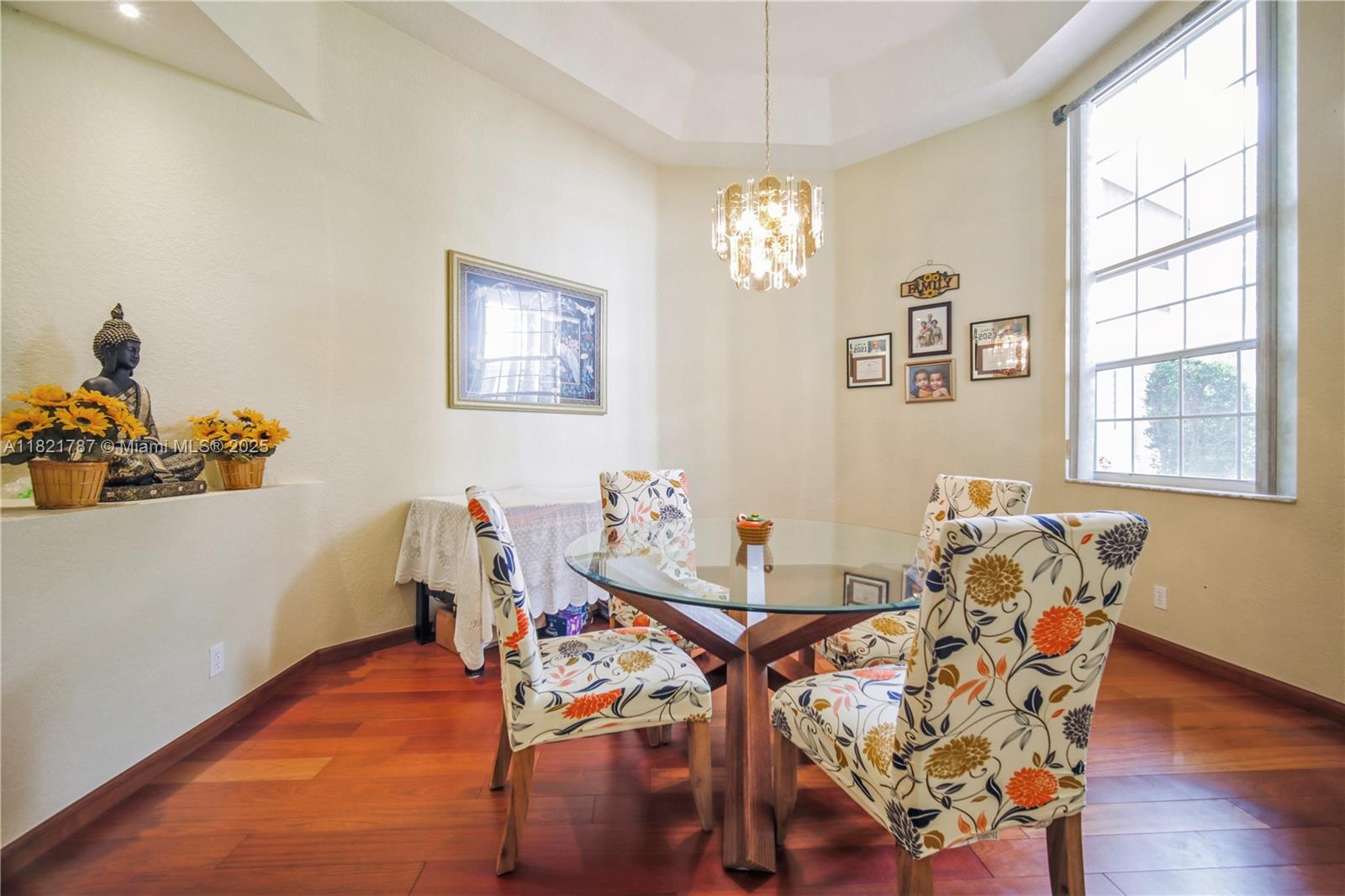 12620 Countryside Terrace Cooper City, FL 33330 - Photo 7 of 40 a view of a dining room with furniture and chandelier