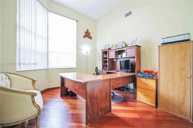 a room with furniture and a wooden floor