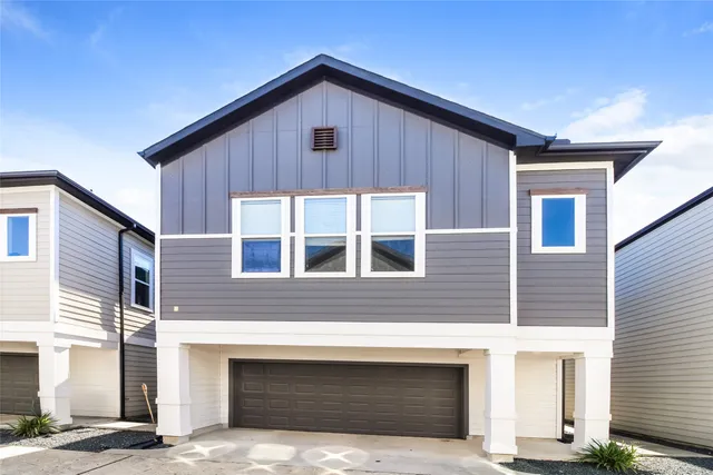 a front view of a house with a garage