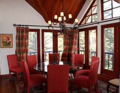 63 Willow Place, Unit 2 Vail, CO 81657 - Photo 6 of 8 a dining room with furniture a chandelier and wooden floor