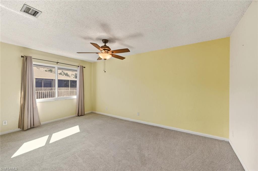 272 Palm Drive, Unit 2 Naples, FL 34112 - Photo 20 of 44 a view of empty room with windows