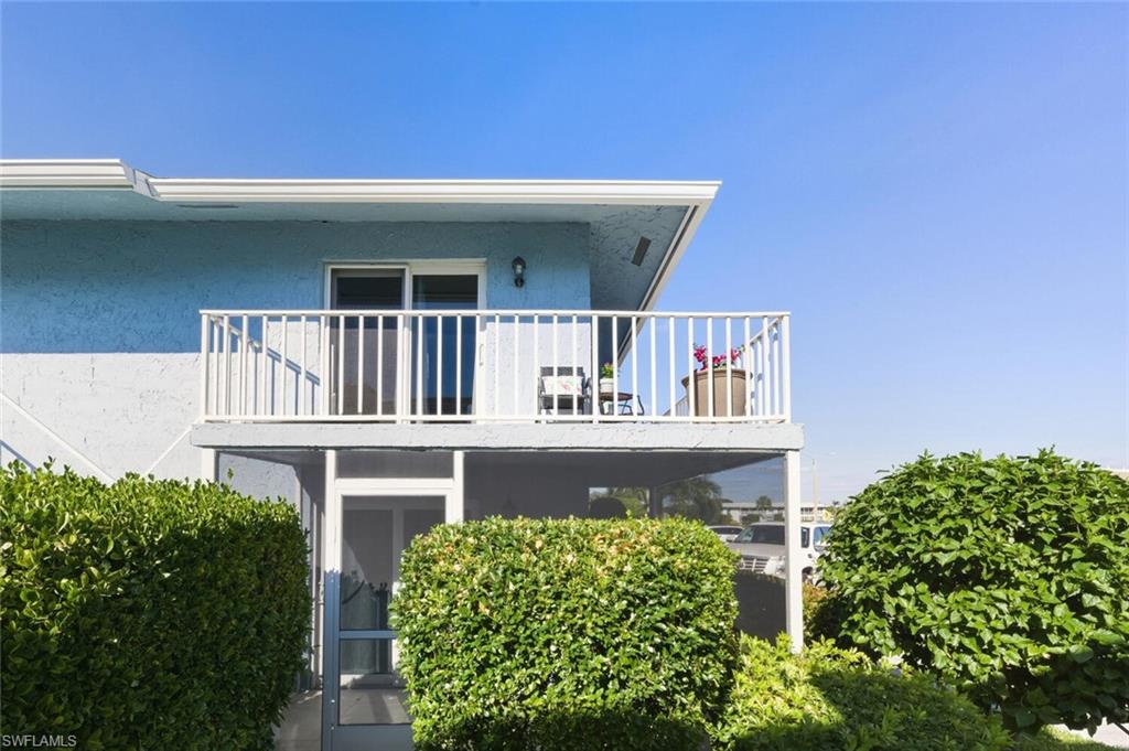 272 Palm Drive, Unit 2 Naples, FL 34112 - Photo 2 of 44 a view of balcony with plants