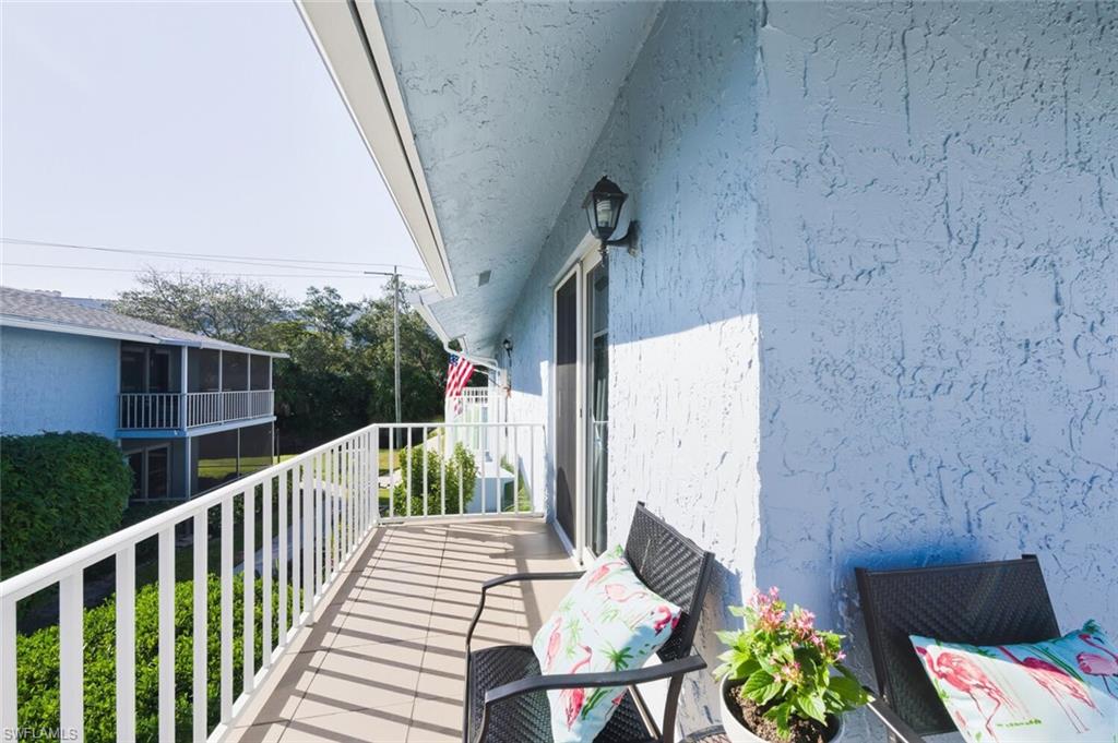 272 Palm Drive, Unit 2 Naples, FL 34112 - Photo 30 of 44 a view of balcony with furniture