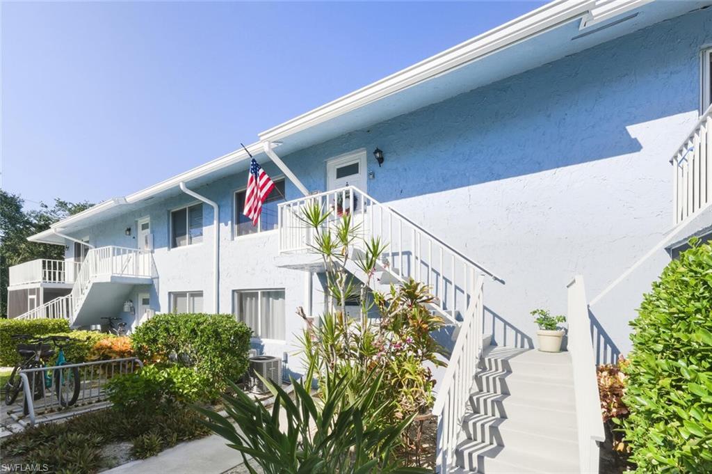 272 Palm Drive, Unit 2 Naples, FL 34112 - Photo 3 of 44 a front view of building with an outdoor space