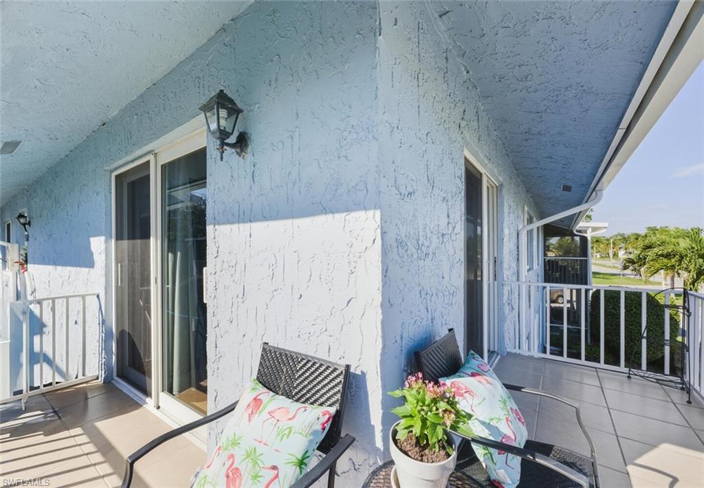 272 Palm Drive, Unit 2 Naples, FL 34112 - Photo 31 of 44 a view of a patio with couple of chairs
