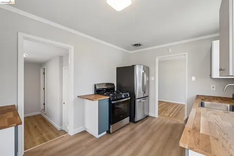 a kitchen with a refrigerator and a sink