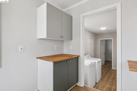 a utility room with sink dryer and washer