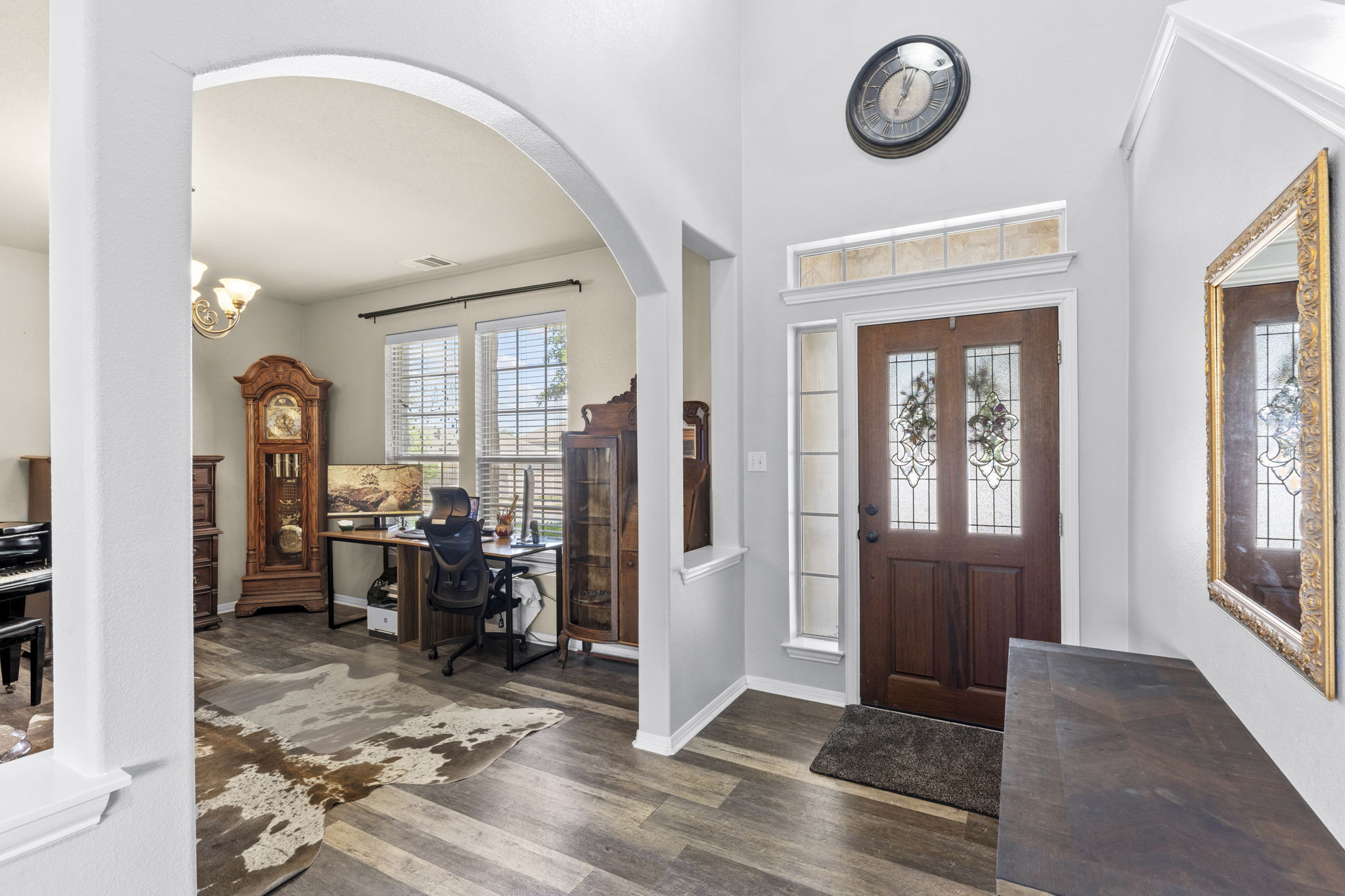 227 Sandstone Trail Buda, TX 78610 - Photo 4 of 33 Entry foyer with wood-finish flooring and a decorative front door featuring leaded glass panels and sidelights