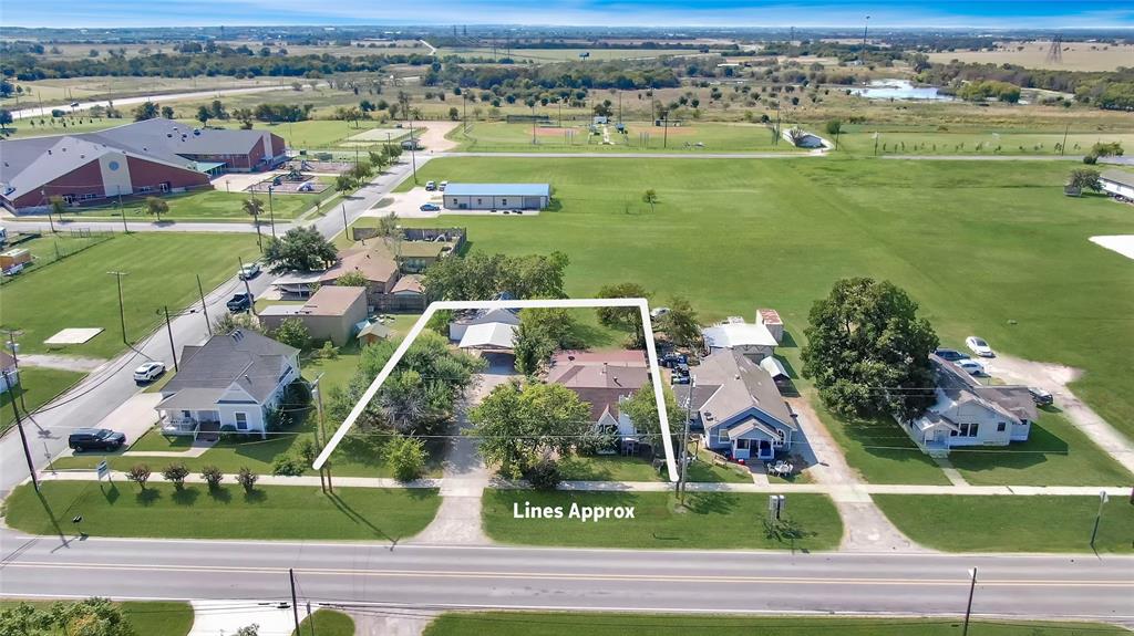 305 West Main Street Gunter, TX 75058 - Photo 2 of 8 an aerial view of residential houses with outdoor space