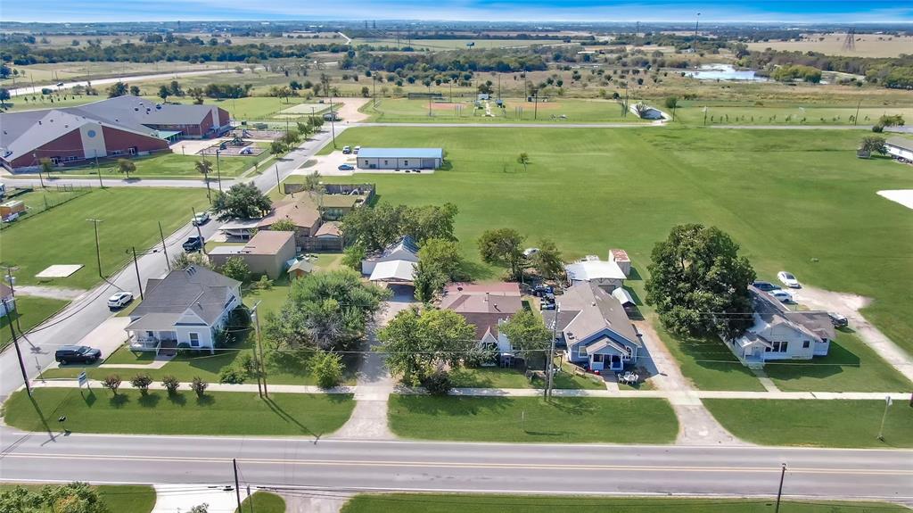 305 West Main Street Gunter, TX 75058 - Photo 3 of 8 an aerial view of a house with a garden