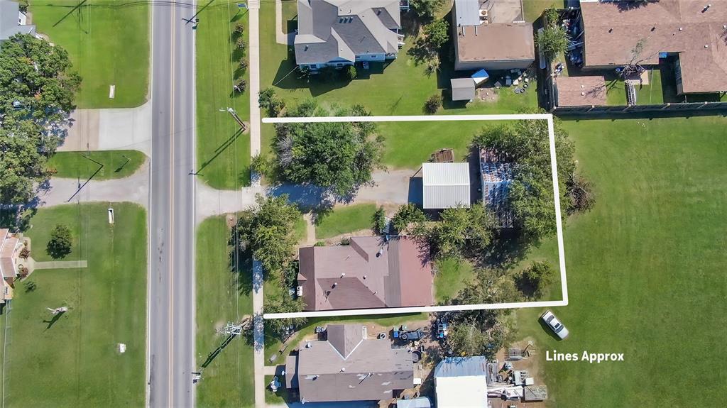 305 West Main Street Gunter, TX 75058 - Photo 6 of 8 an aerial view of a house with a garden