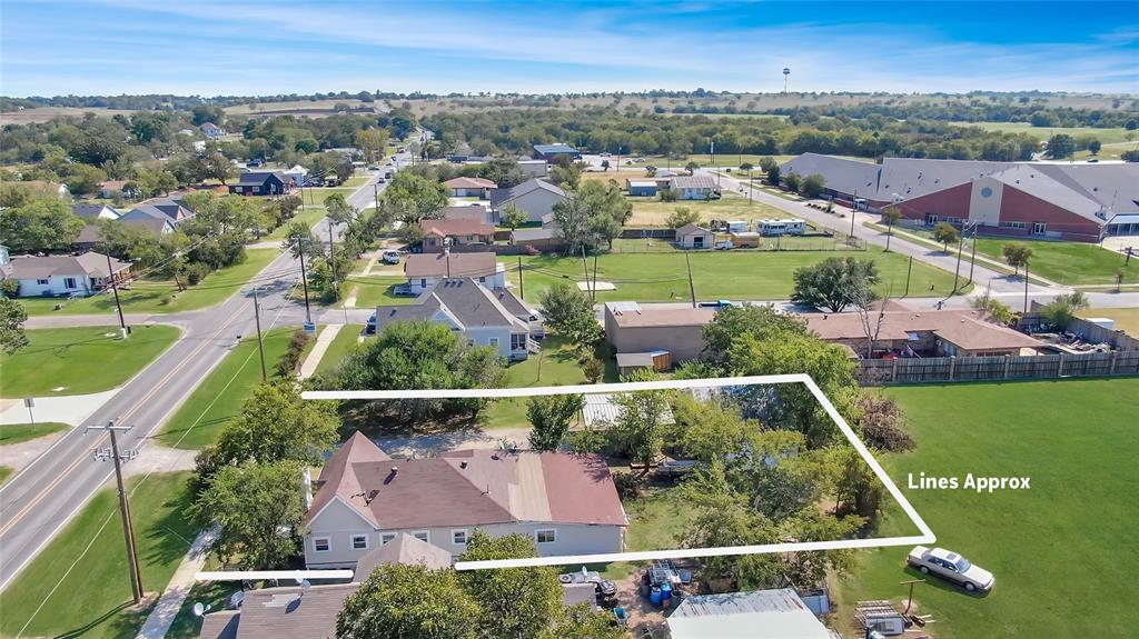 305 West Main Street Gunter, TX 75058 - Photo 8 of 8 an aerial view of residential houses with outdoor space and trees