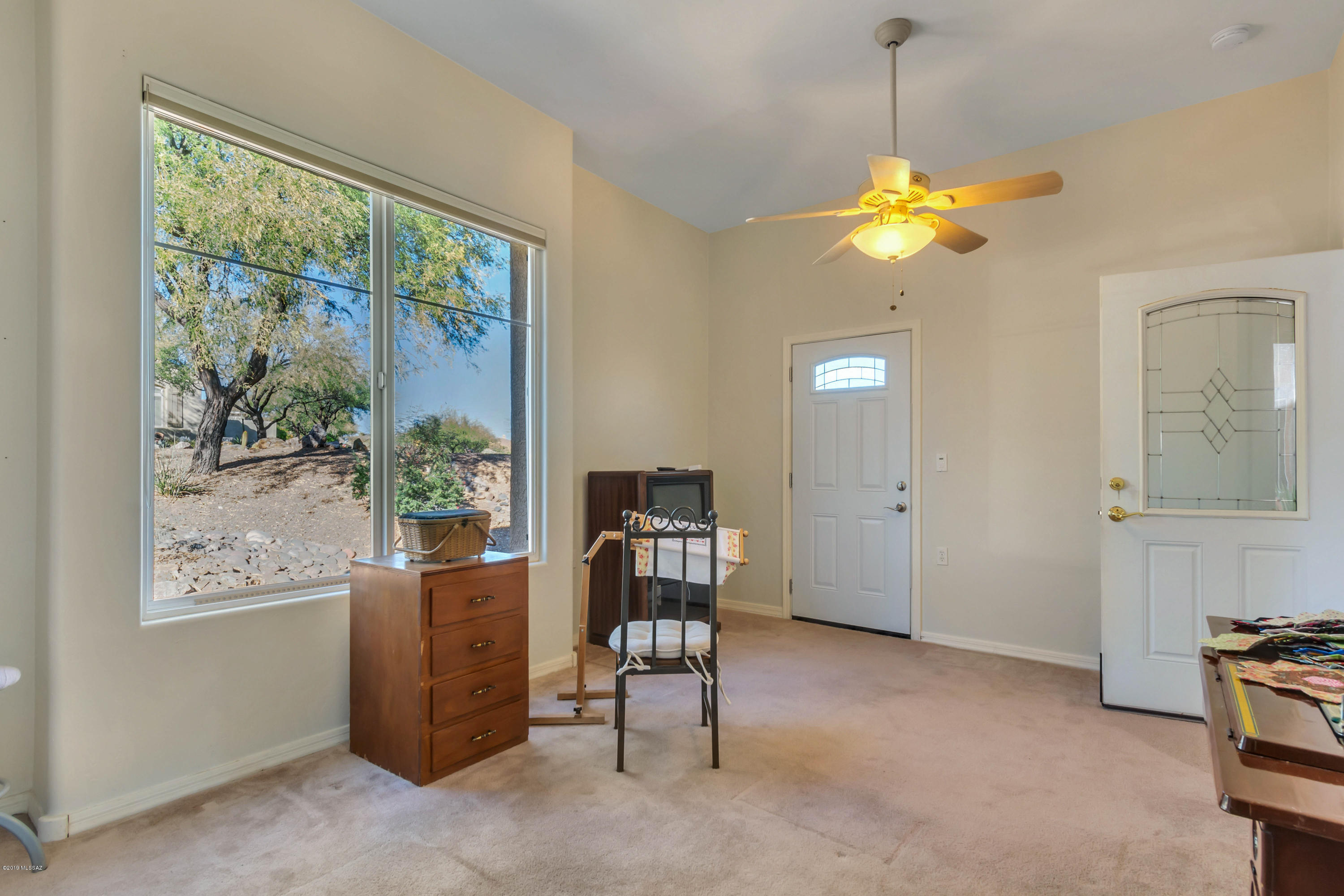 12682 North Spirit Mountain Road Oro Valley, AZ 85755 - Photo 12 of 40 a view of a livingroom with furniture and a window