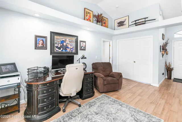 a view of a livingroom with furniture window and wooden floor