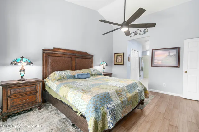a bathroom with a double vanity sink a mirror and a shower