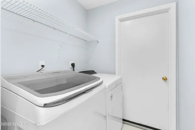 a view of a house with a yard and a garden