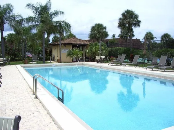 a view of a swimming pool with a patio