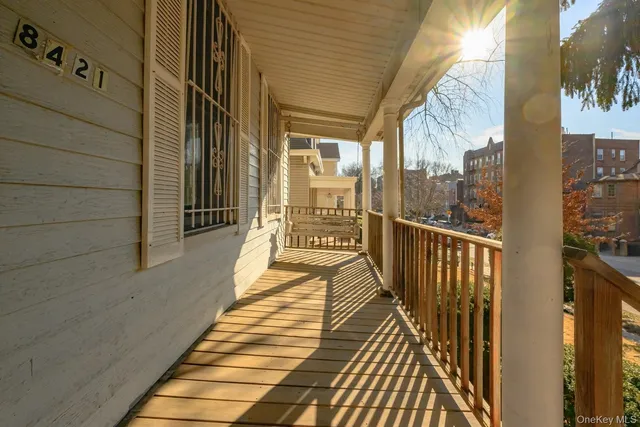 a view of a balcony with wooden floor