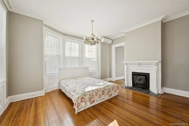 a bedroom with a bed and a fireplace