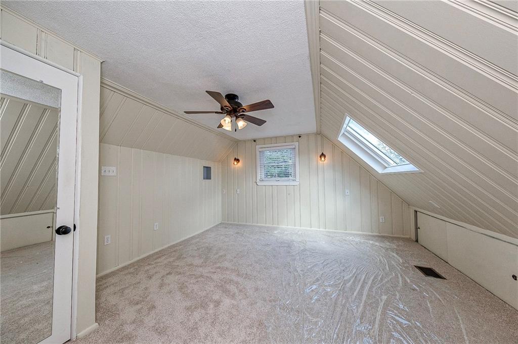 1816 Cardinal Avenue Aliquippa, PA 15001 - Photo 15 of 30 a view of a livingroom with a ceiling fan and window