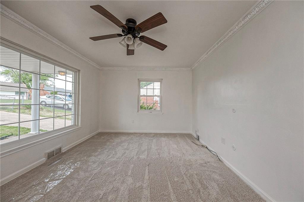 1816 Cardinal Avenue Aliquippa, PA 15001 - Photo 8 of 30 an empty room with windows and fan