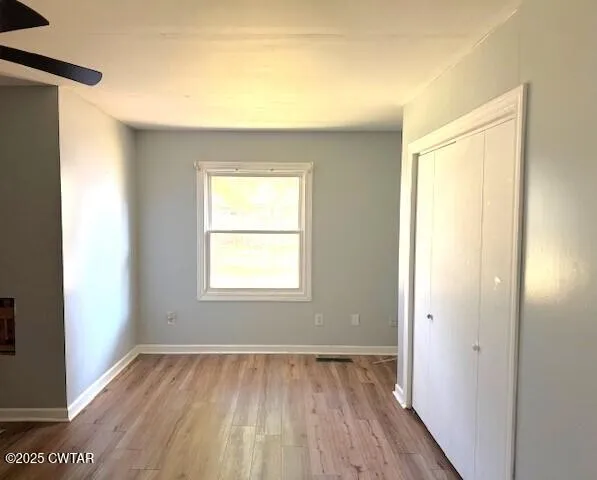 a view of an empty room and window