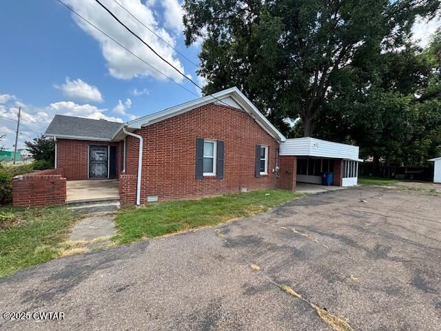 617 King Street Ridgely, TN 38080 - Photo 4 of 23 a front view of a house with a yard and garage