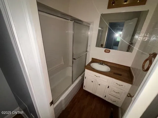 a kitchen with stainless steel appliances a refrigerator and a stove top oven