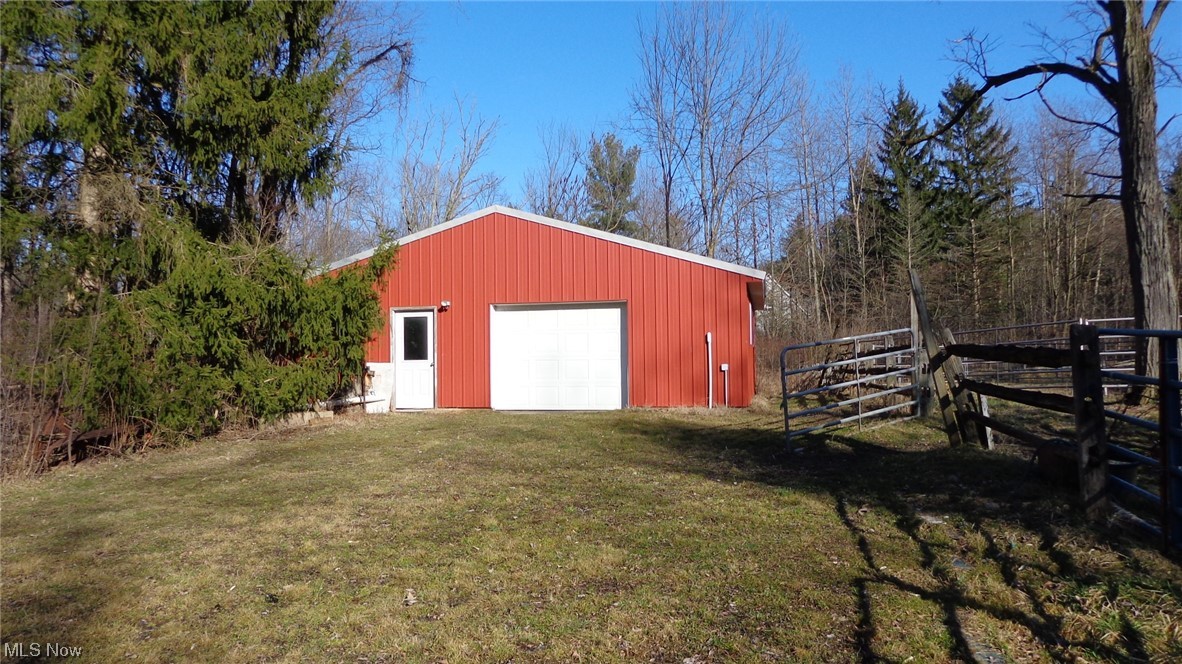 10157 Ravenna Road Chardon, OH 44024 - Photo 14 of 34 View of outdoor structure with a garage and a lawn