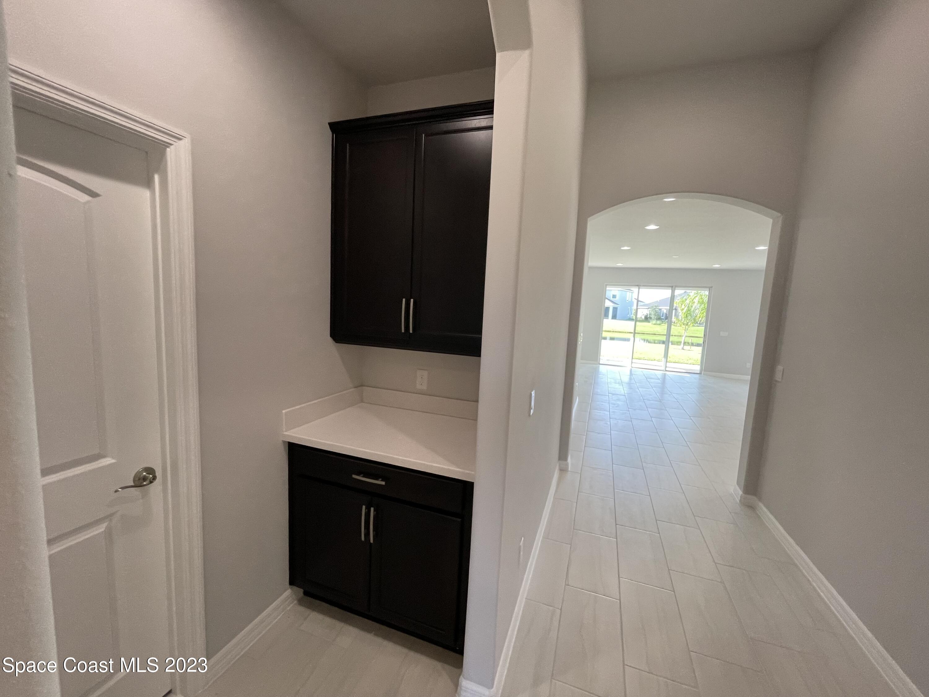 3085 Zeler Place Melbourne, FL 32940 - Photo 13 of 16 a bathroom with a sink and a mirror
