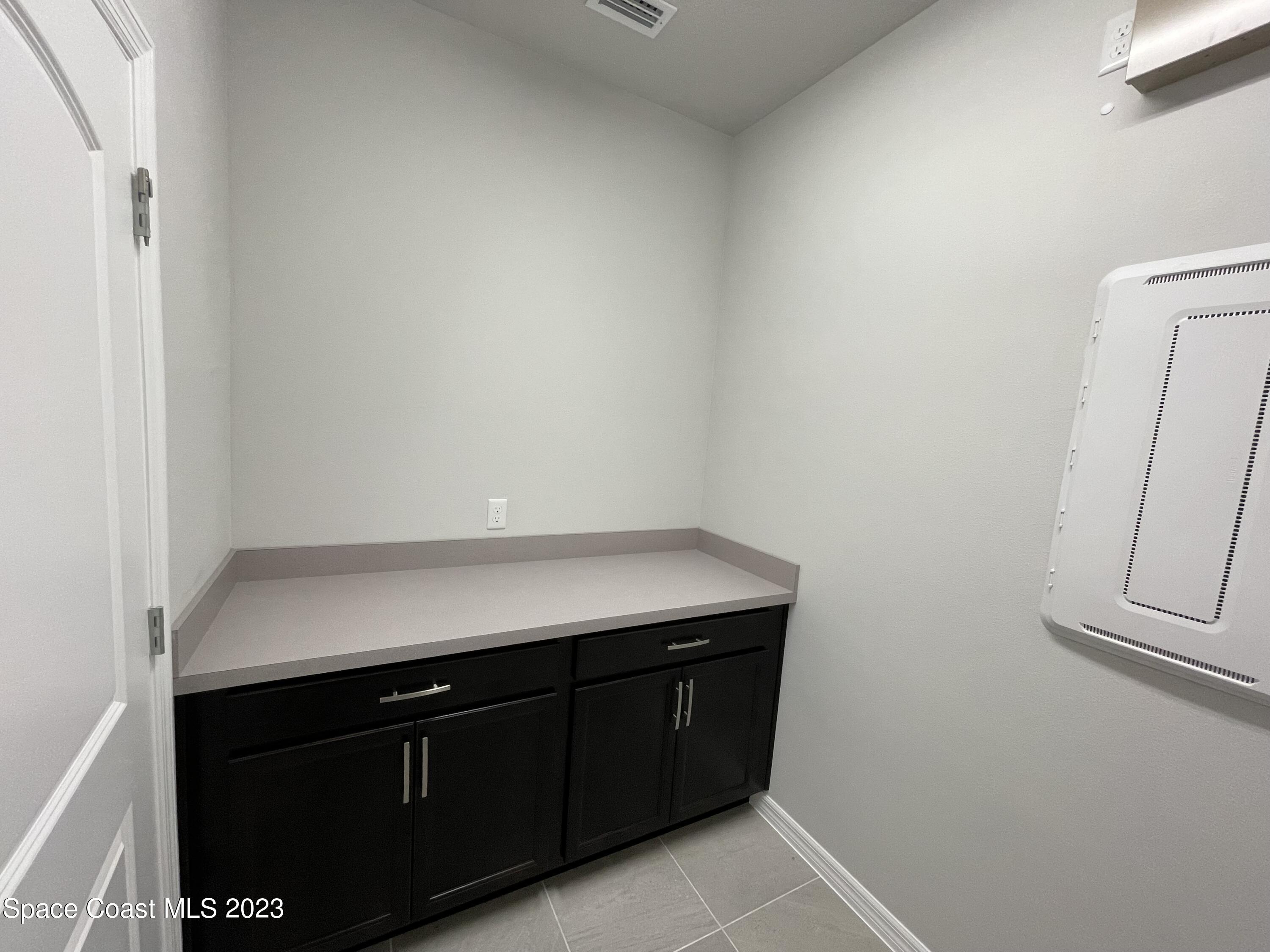 3085 Zeler Place Melbourne, FL 32940 - Photo 15 of 16 a room with storage