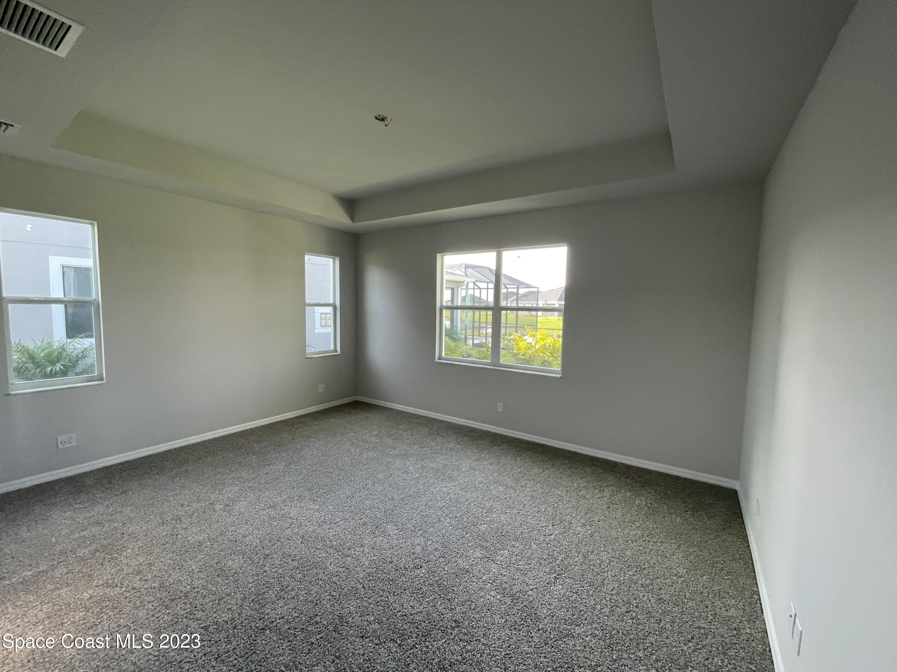 3085 Zeler Place Melbourne, FL 32940 - Photo 4 of 16 an empty room with windows