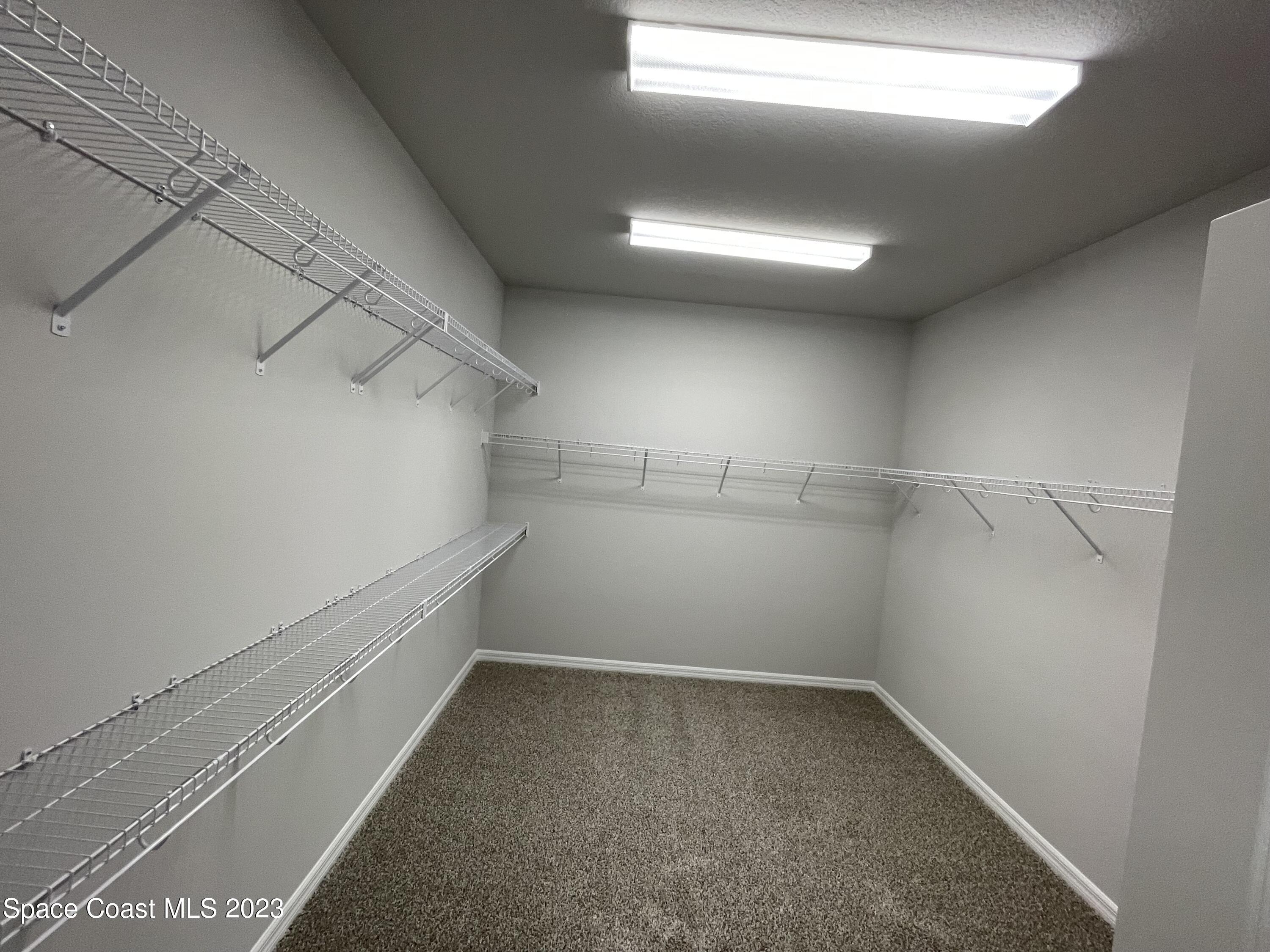 3085 Zeler Place Melbourne, FL 32940 - Photo 7 of 16 a view of a room with racks on the wall